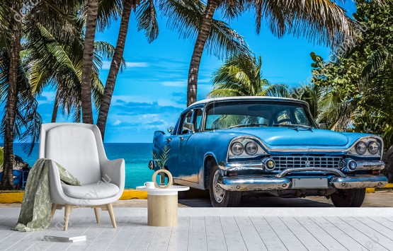Wizualizacja fototapety z widokiem na amerykański, niebieski samochód retro zaparkowany przy plaży na Kubie. Fototapeta do pokoju młodzieżowego, salonu, sypialni, pokoju dziennego, gabinetu, biura, przedpokoju.