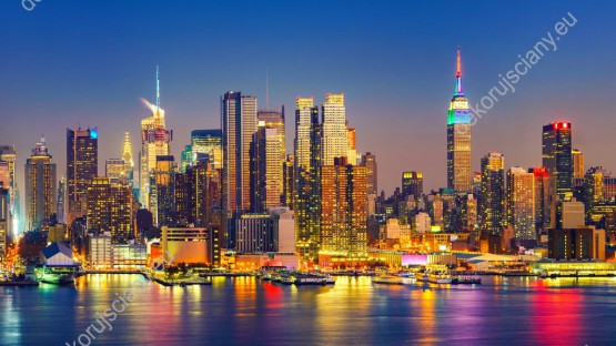 Wzornik, piękny obraz z dzielnicą miasta Manhattan w Nowym Jorku. Nocna sceneria ładnie będzie wyglądać na ścianie pokoju młodzieżowego, sypialni, salonu, biura, czy gabinetu.