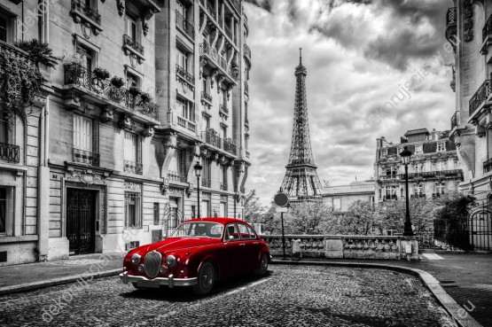 Wzornik, czarno-biały obraz z czerwoną, retro limuzyną, na ulicy Paryża z widokiem na wieżę Eiffla, we Francji. Nowoczesny obraz świetnie sprawdzi się w pokoju dziennym, młodzieżowym, salonie, sypialni, przedpokoju, jadalni, biurze, gabinecie oraz pokoju młodzieżowym.