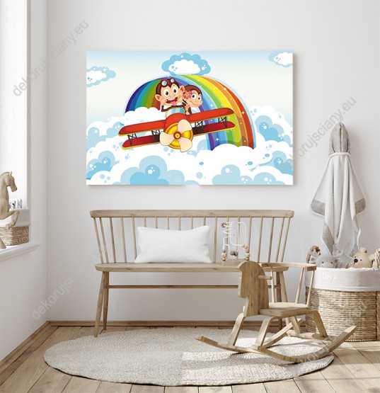 Wizualizacja obrazu do pokoju dziecięcego przedstawiające małpy lecące samolotem wśród chmur i kolorową tęczę na niebie.