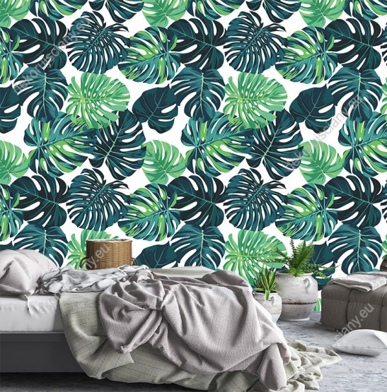 Wizualizacja tapety do pokoju dziennego, sypialni, salonu, przedpokoju, biura z motywem tropikalnym. Tapeta przedstawia zielone liście egzotycznych roślin, na białym tle.
