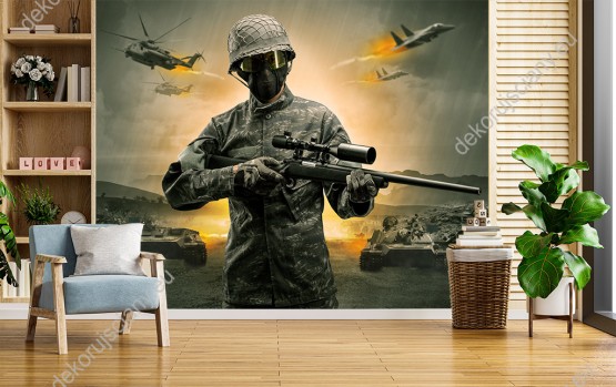 Wizualizacja fototapety o tematyce wojennej. Żołnierz z bronią w ręku na polu walki. Fototapeta do pokoju młodzieżowego, salonu, sypialni, pokoju dziennego, biura, przedpokoju.