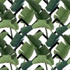 Wzornik tapety do pokoju młodzieżowego, pokoju dziennego, sypialni, salonu, przedpokoju, biura. Tapeta przedstawia duże, zielone liście palm, na białym tle.