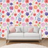 Wizualizacja tapety do pokoju dziecięcego, młodzieżowego, sypialni w wiosennej aurze przedstawiająca łąkę pełną kolorowych kwiatów i gałązek, na różowym tle.