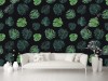 Wizualizacja tapety do pokoju dziennego, sypialni, salonu, przedpokoju, biura z motywem tropikalnym. Tapeta przedstawia zielone liście egzotycznych roślin, na czarnym tle.