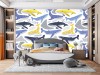 Wizualizacja tapety na ścianę do pokoju dziecięcego w płynące niebieskie, żółte i granatowe wieloryby i różne wzory, na białym tle.
