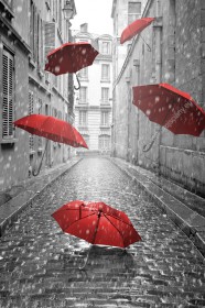 Wzornik fototapety w nowoczesnym stylu do sypialni, salonu, przedpokoju, biura, gabinetu, pokoju młodzieżowego. Fototapeta przedstawia ulice miasta w czasie pory deszczowej i spadające, czerwone parasole.