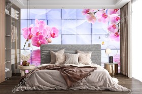 Wizualizacja fototapety przedstawia gałązki różowych kwiatów orchidei odbijające się lustrze wody, utworzonej przez sześciany dające w całości efekt 3D. Fototapeta do pokoju dziennego, młodzieżowego, sypialni, salonu, biura, gabinetu, przedpokoju i jadalni.